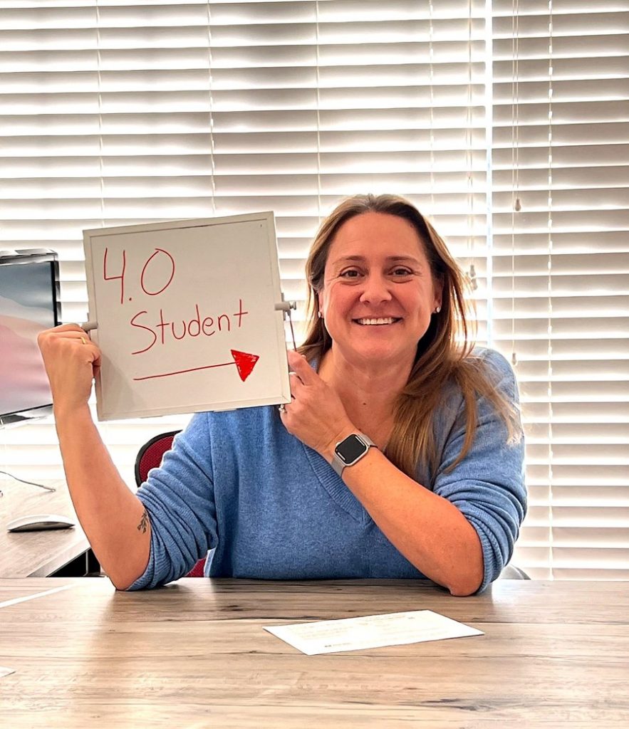 Jen Stanley, 4.0 student, at her desk