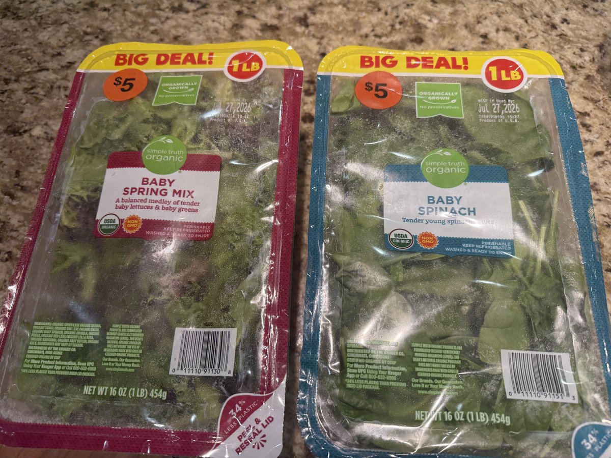 Two resealable tubs of greens: baby spring mix and baby spinach